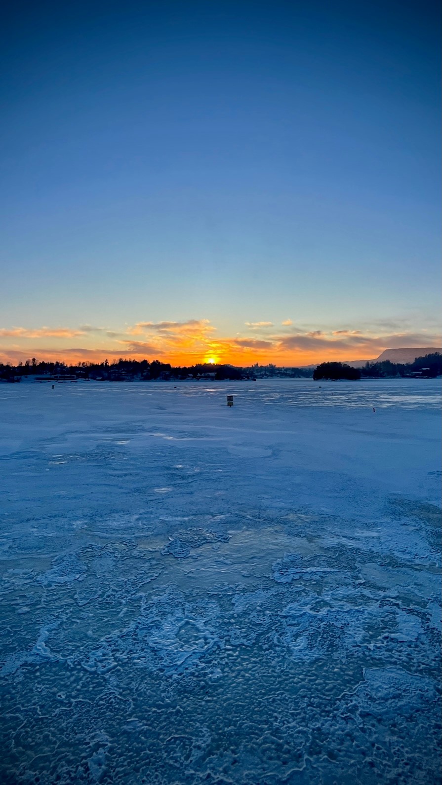 Sunset over frozen water