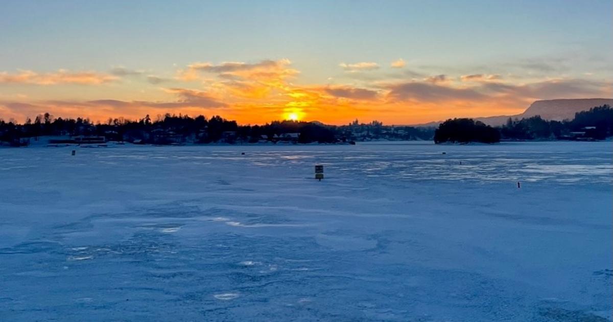 Sunset over frozen water